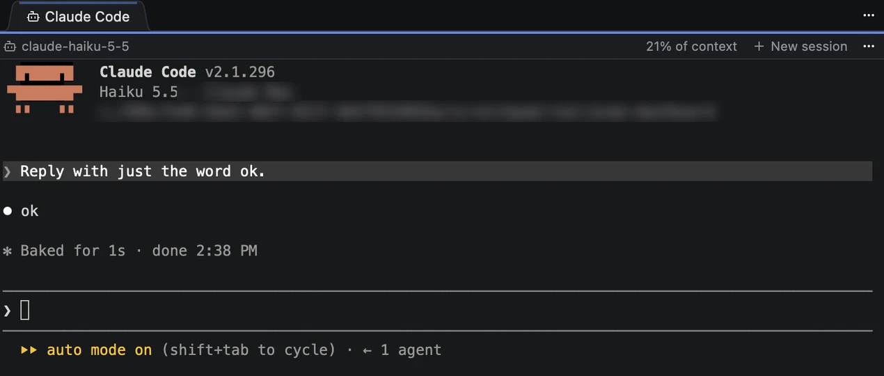 Terminal view of the same session: Claude Code's own screen, with its banner, the same request and answer, and a line reading Baked for 1s. The working folder path is blurred.